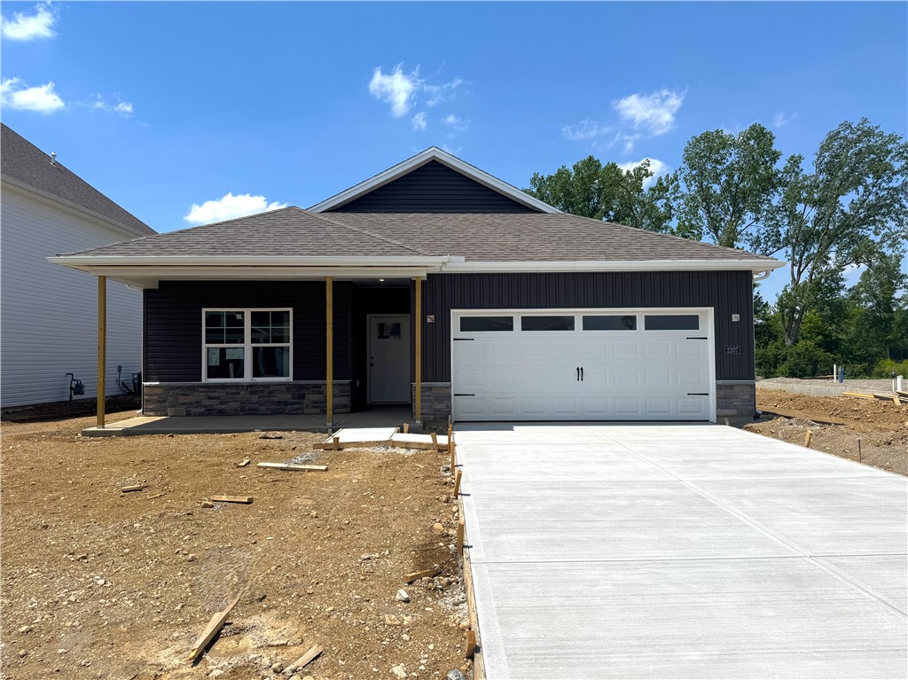 2207 Hackberry Street Springfield, OH 45505 - Photo 2 of 3 A new construction home awaits with a welcoming covered front porch and an attached garage.