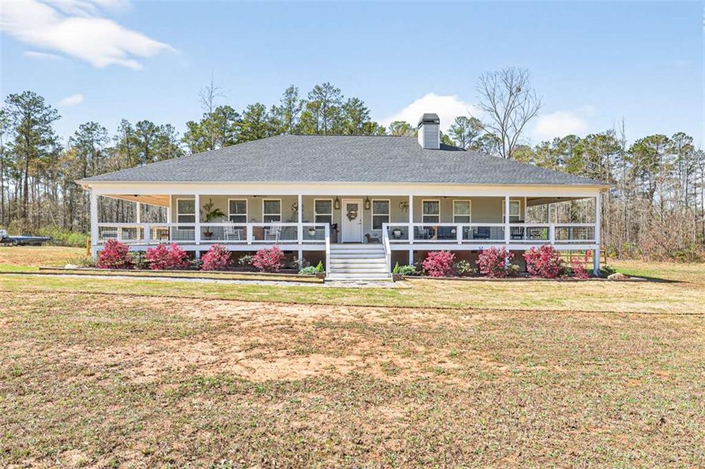 2361 County Line Road Mansfield, GA 30055 - Photo 2 of 57 a view of a house with a big yard and large trees