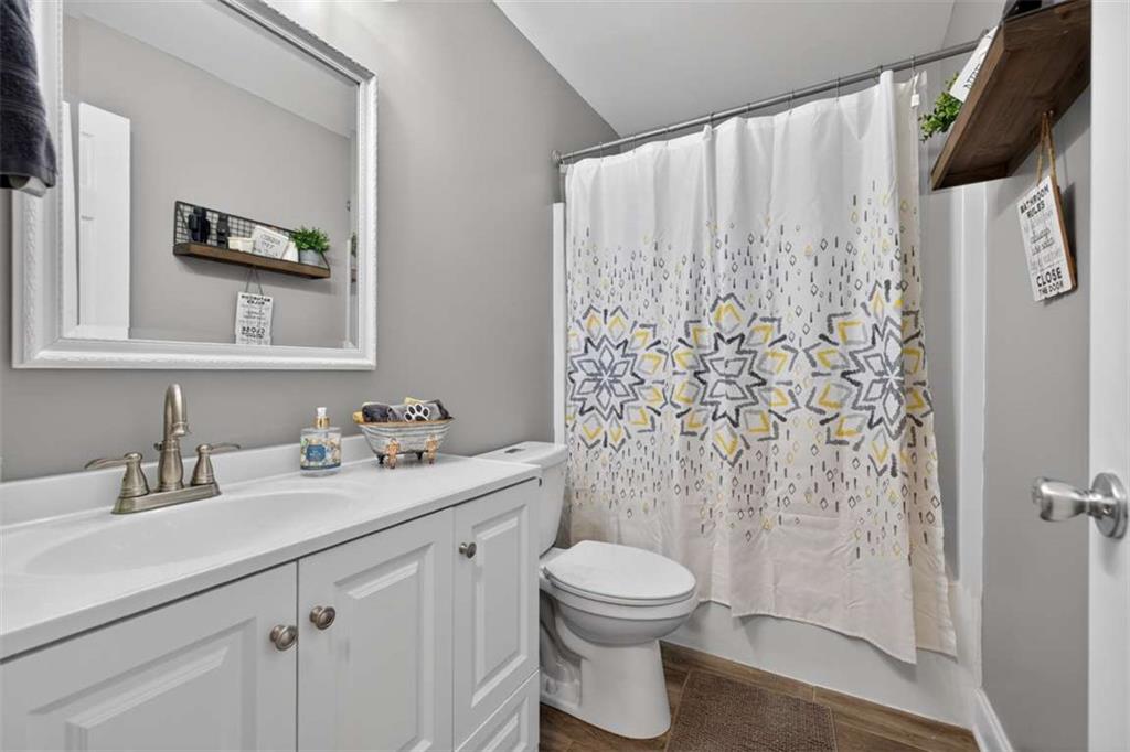 2361 County Line Road Mansfield, GA 30055 - Photo 26 of 57 a bathroom with a toilet sink and mirror