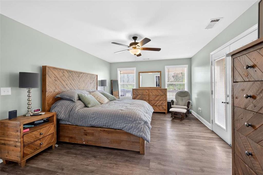 2361 County Line Road Mansfield, GA 30055 - Photo 33 of 57 a bedroom with a bed and wooden floor