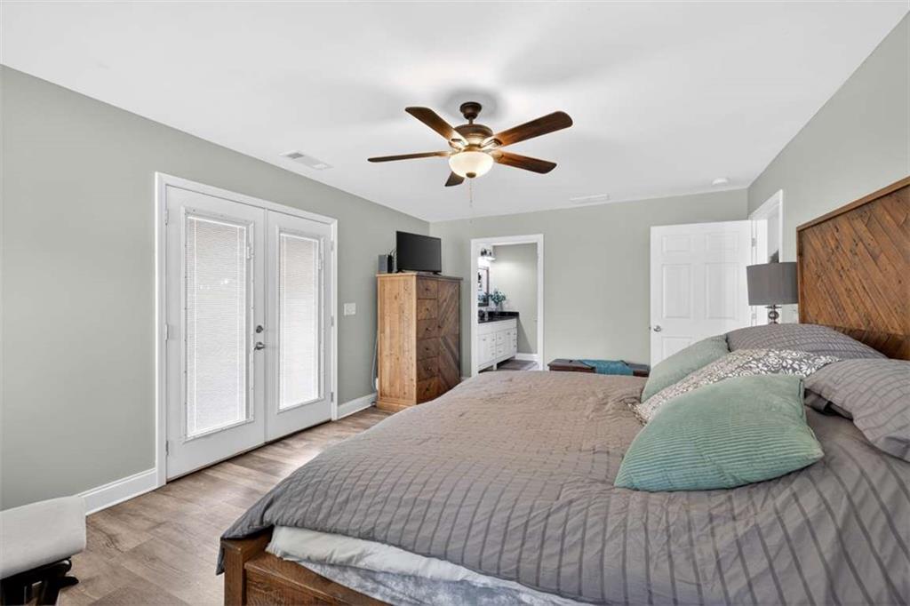 2361 County Line Road Mansfield, GA 30055 - Photo 34 of 57 a bedroom with a bed and a ceiling fan