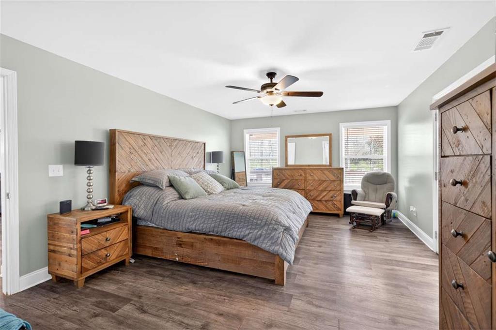 2361 County Line Road Mansfield, GA 30055 - Photo 35 of 57 a bedroom with a bed and wooden floor