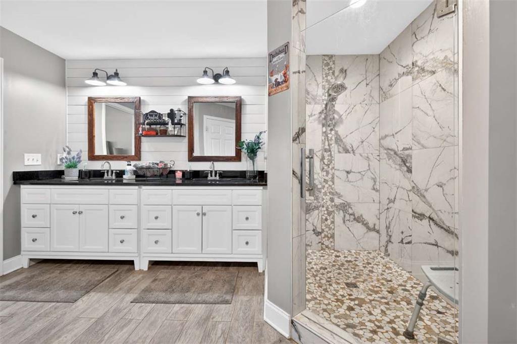 2361 County Line Road Mansfield, GA 30055 - Photo 38 of 57 a spacious bathroom with double vanity and a mirror