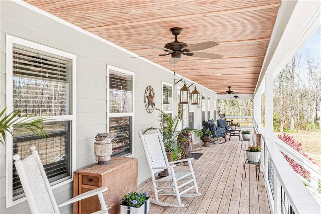 2361 County Line Road Mansfield, GA 30055 - Photo 43 of 57 a view of a porch with furniture and a table