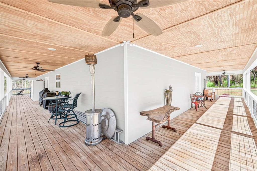 2361 County Line Road Mansfield, GA 30055 - Photo 44 of 57 a outdoor space with lots of chairs and wooden floor