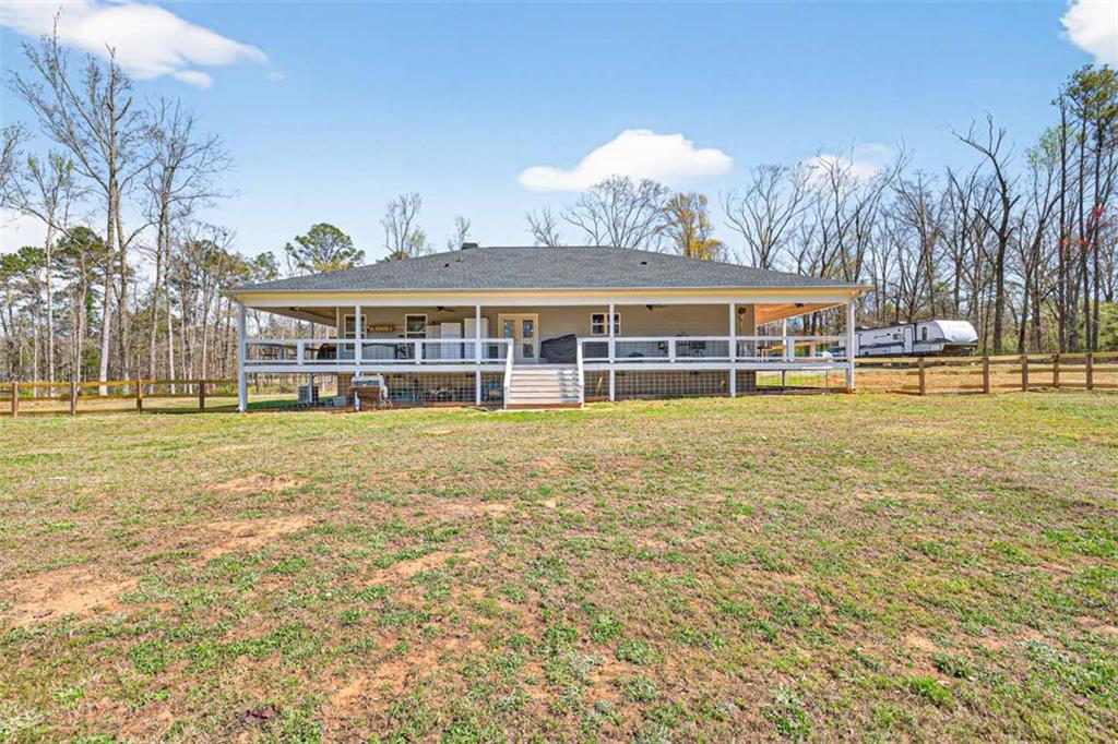 2361 County Line Road Mansfield, GA 30055 - Photo 46 of 57 a view of a house with a big yard and large trees