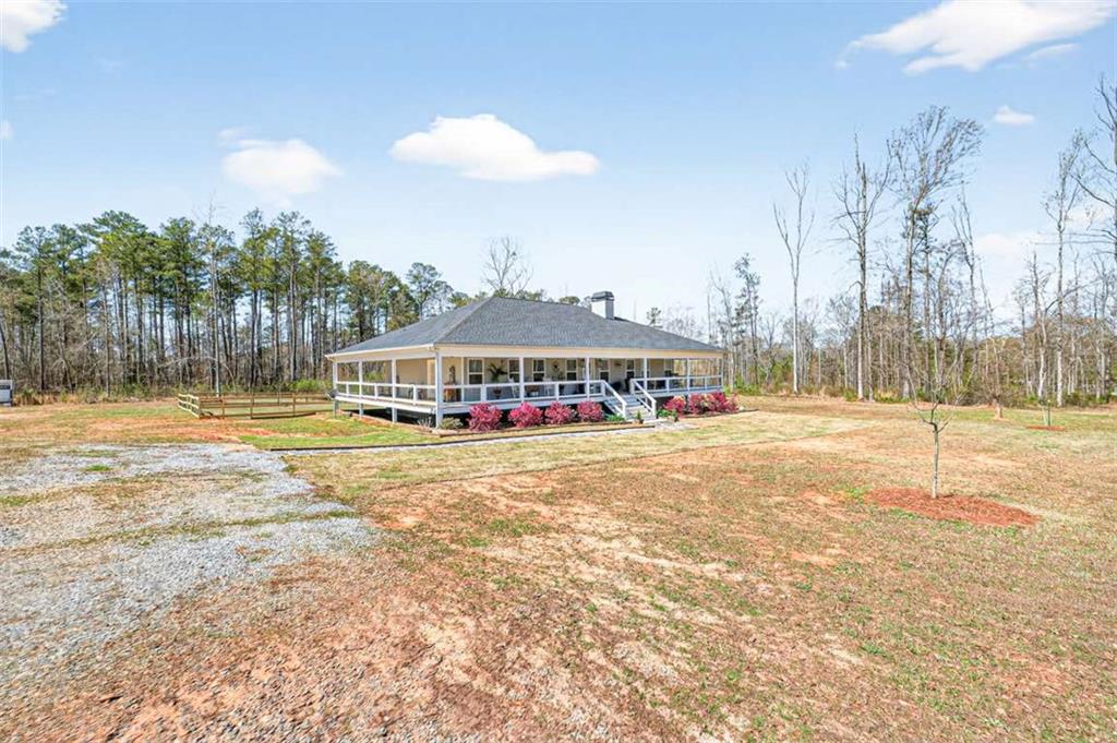 2361 County Line Road Mansfield, GA 30055 - Photo 49 of 57 a view of a swimming pool with an outdoor space and seating area