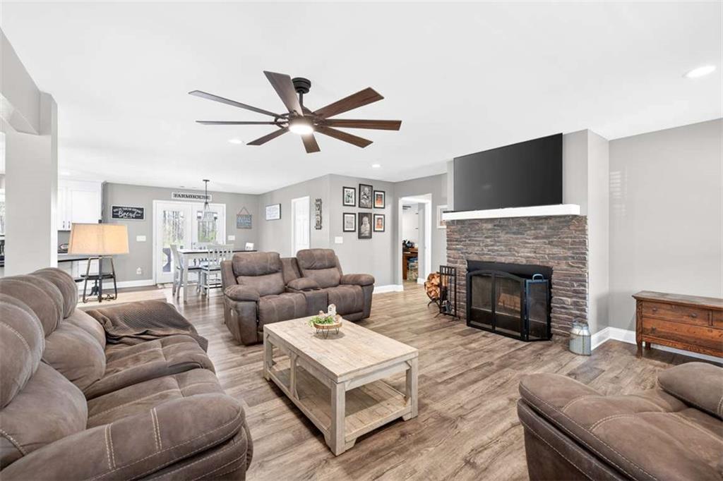 2361 County Line Road Mansfield, GA 30055 - Photo 7 of 57 a living room with furniture a fireplace