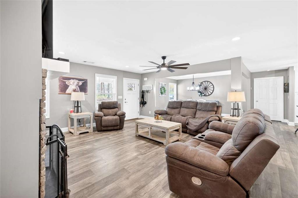 2361 County Line Road Mansfield, GA 30055 - Photo 10 of 57 a living room with furniture and a wooden floor