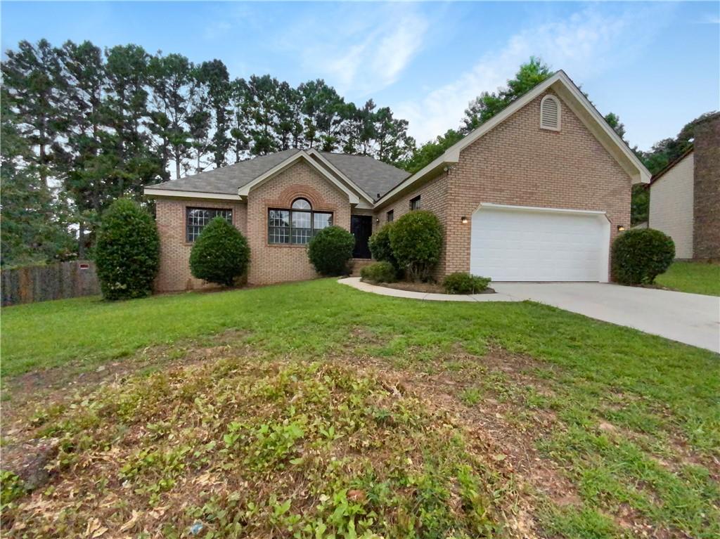 3251 Old Salem Road Southeast Conyers, GA 30013 - Photo 1 of 1 a front view of house with yard and green space