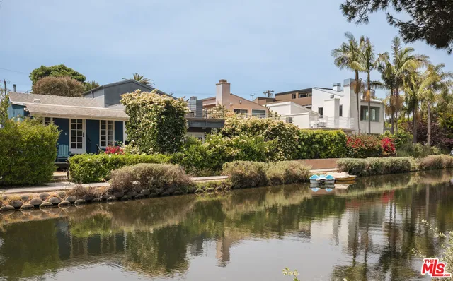 a front view of a house with a lake view