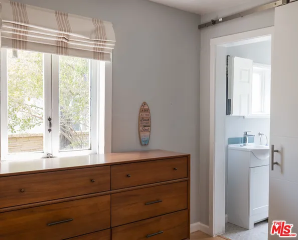 a bathroom with a toilet and shower