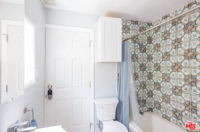 a view of a backyard with table and chairs