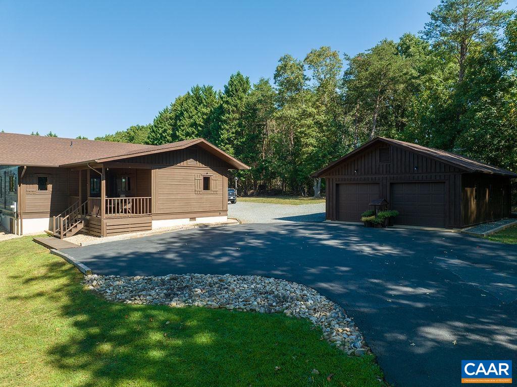6033 Amicus Road Ruckersville, VA 22968 - Photo 1 of 74 a house view with a garden space