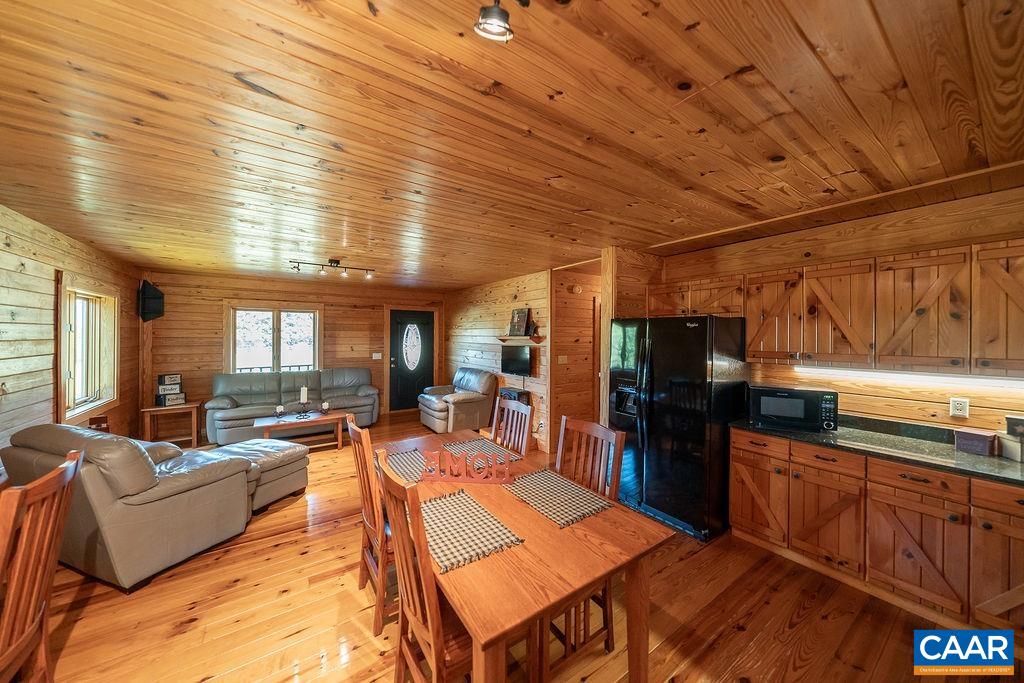 6033 Amicus Road Ruckersville, VA 22968 - Photo 20 of 74 a living room with lots of furniture and kitchen view