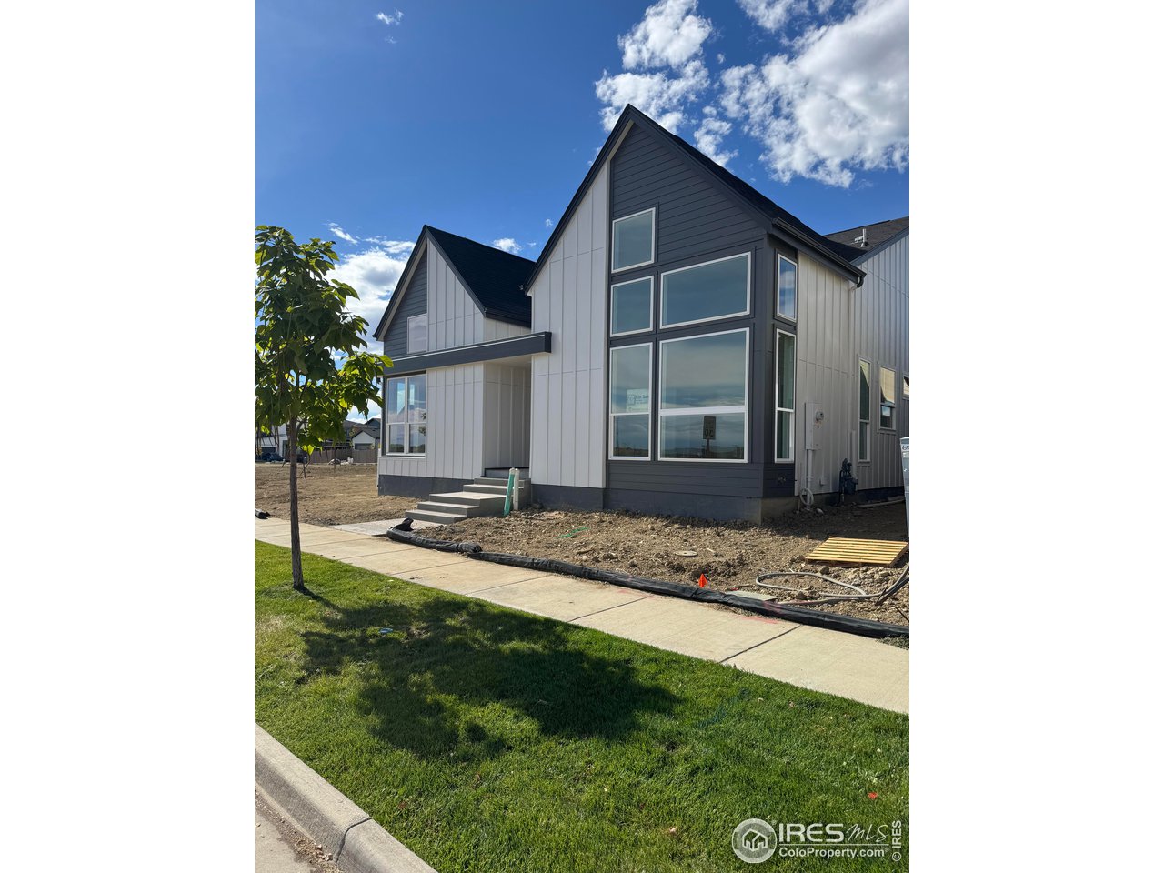 607 Mountain Drive Longmont, CO 80503 - Photo 2 of 18 a view of a house with backyard and porch