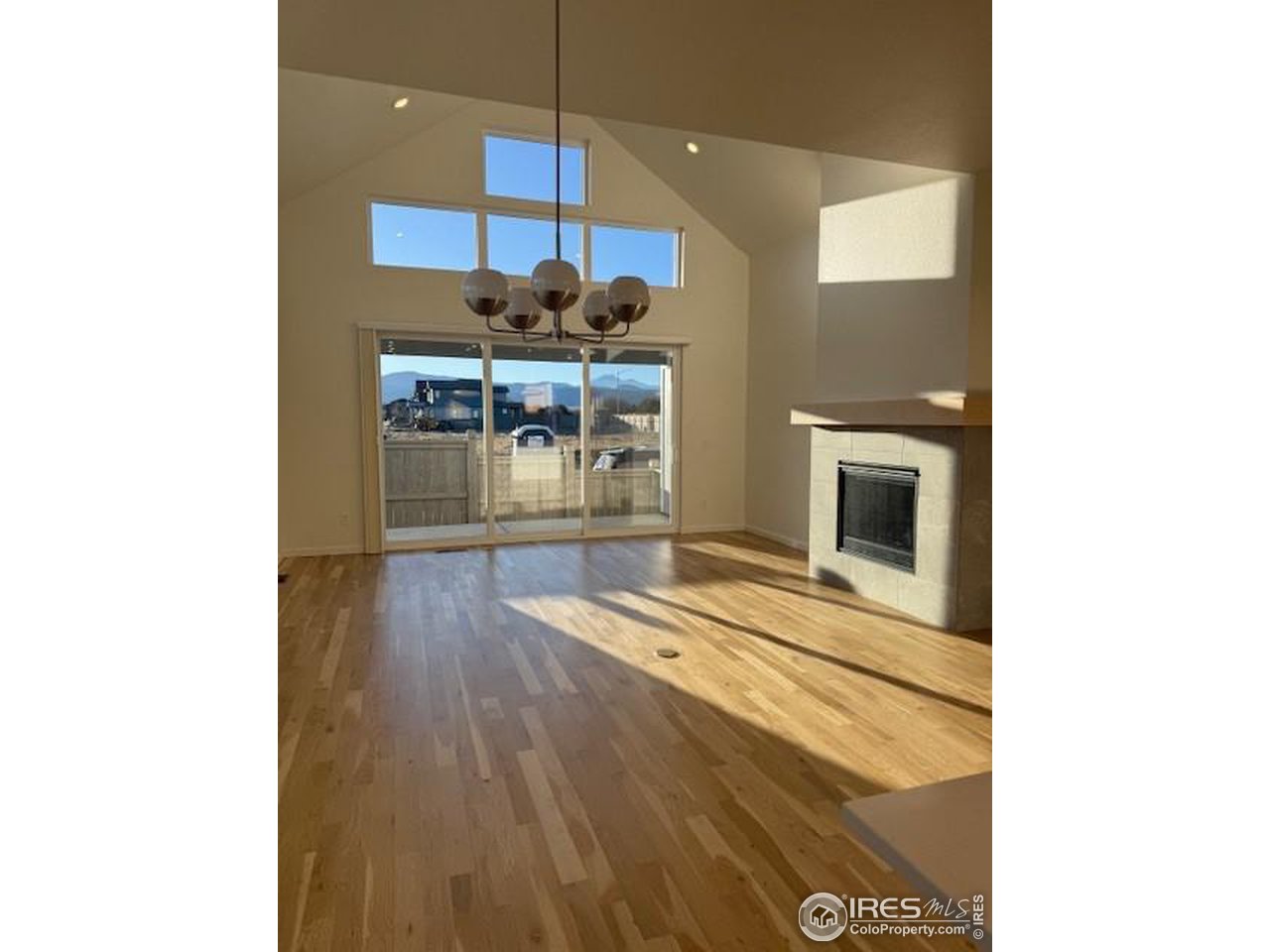 607 Mountain Drive Longmont, CO 80503 - Photo 7 of 18 a view of a dining room with furniture and wooden floor