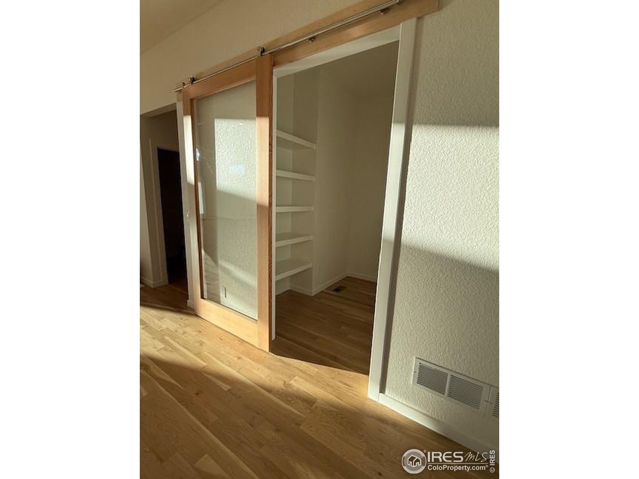 607 Mountain Drive Longmont, CO 80503 - Photo 8 of 18 a bathroom with a glass shower door