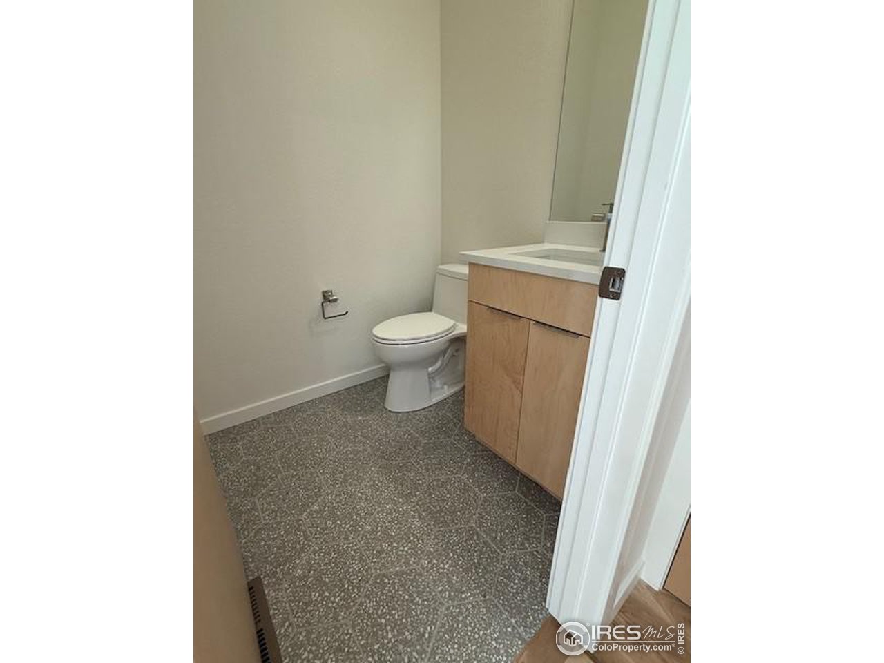 607 Mountain Drive Longmont, CO 80503 - Photo 9 of 18 a bathroom with a toilet and a sink