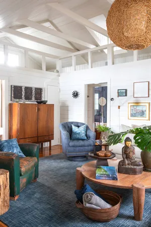 a living room with furniture and a lamp