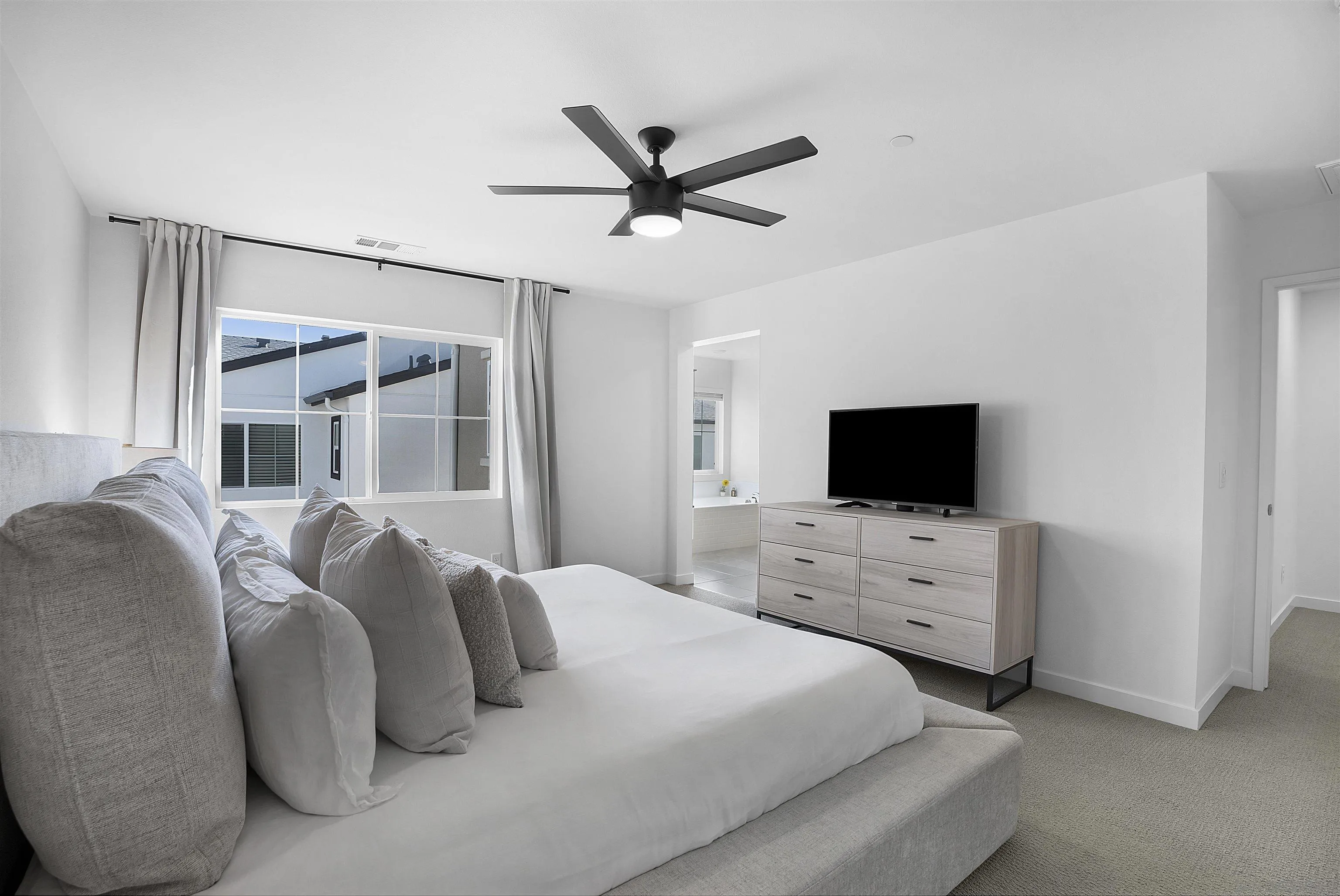 223 Foliage Place Fallbrook, CA 92028 - Photo 11 of 46 a bedroom with a bed and a flat screen tv