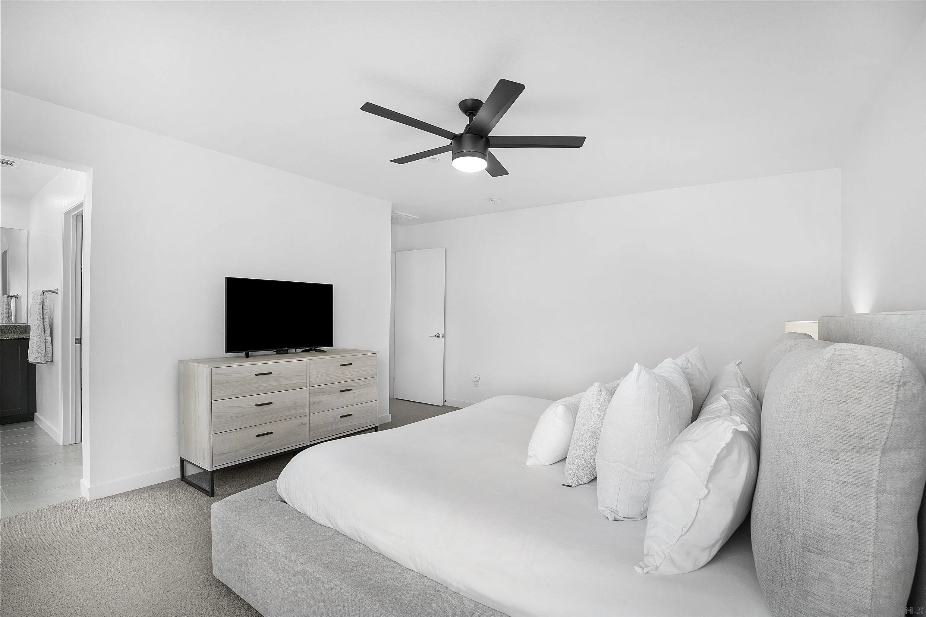 223 Foliage Place Fallbrook, CA 92028 - Photo 12 of 46 a bedroom with a bed and a flat screen tv