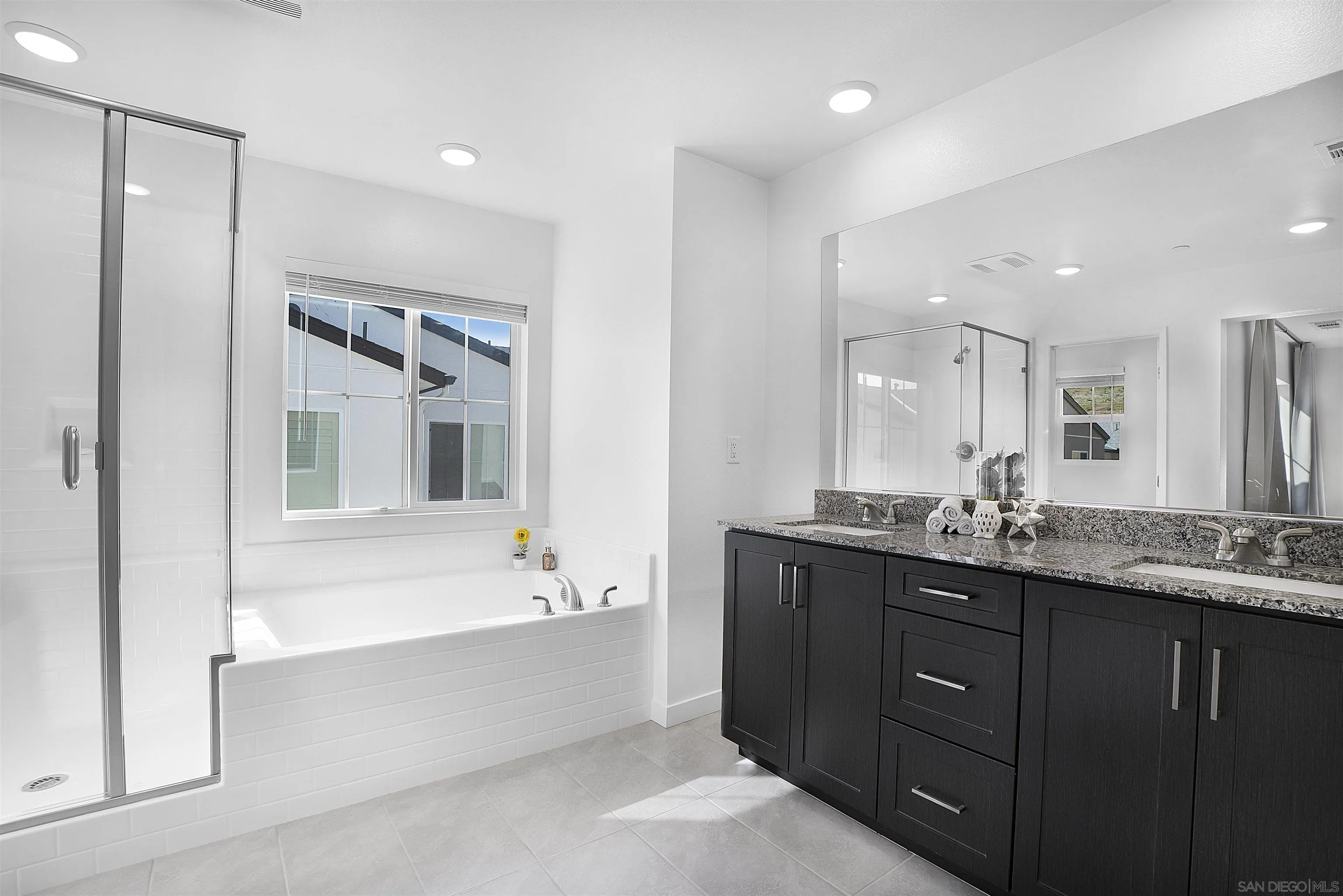 223 Foliage Place Fallbrook, CA 92028 - Photo 13 of 46 a bathroom with a tub a sink shower and mirror