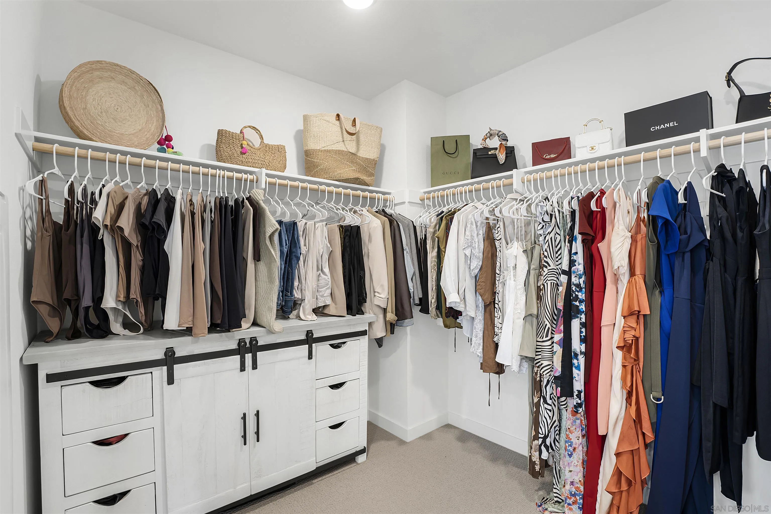 223 Foliage Place Fallbrook, CA 92028 - Photo 16 of 46 a view of walk in closet with clothes and shoes