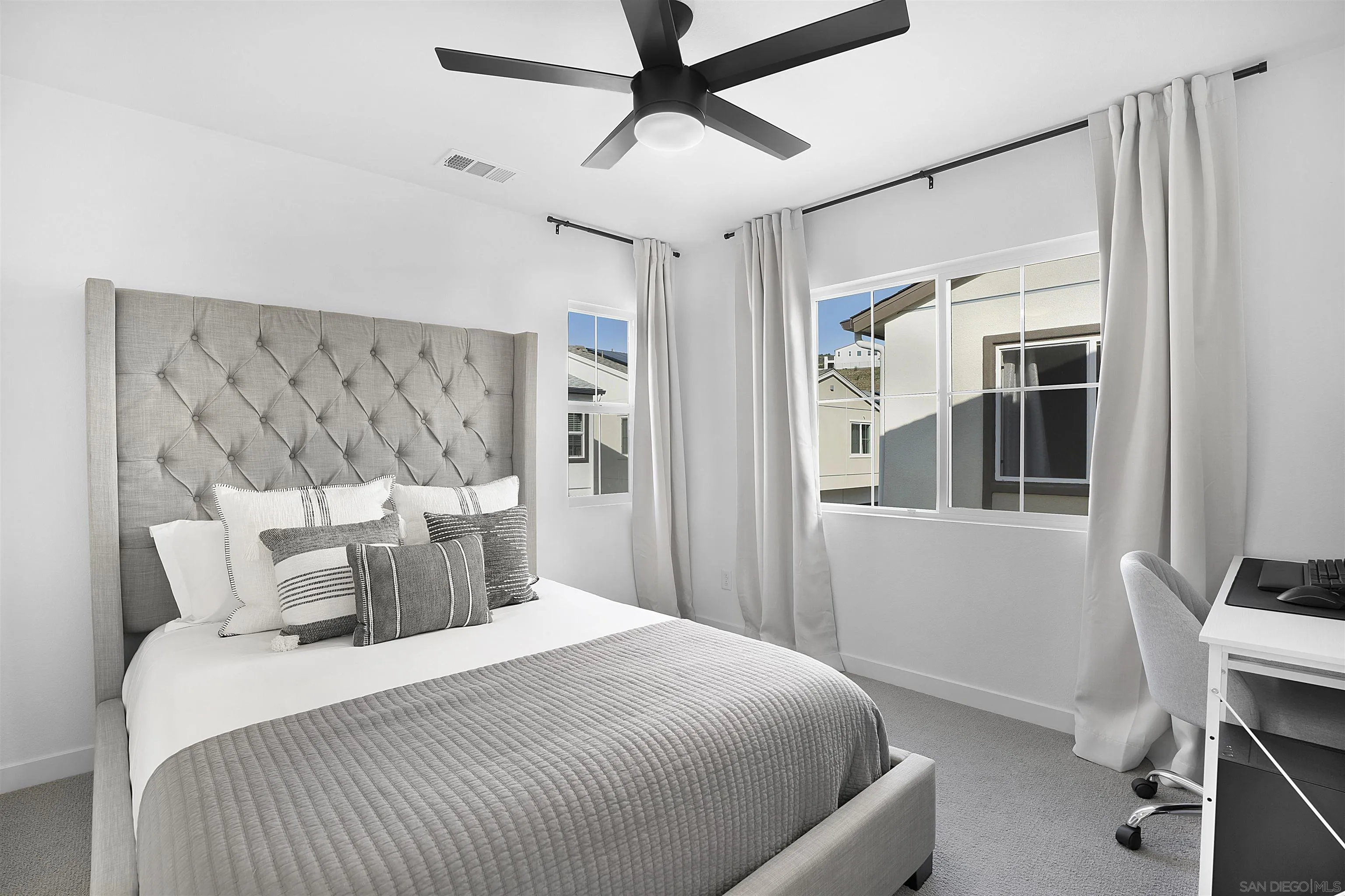 223 Foliage Place Fallbrook, CA 92028 - Photo 19 of 46 a bedroom with a large bed and a chandelier