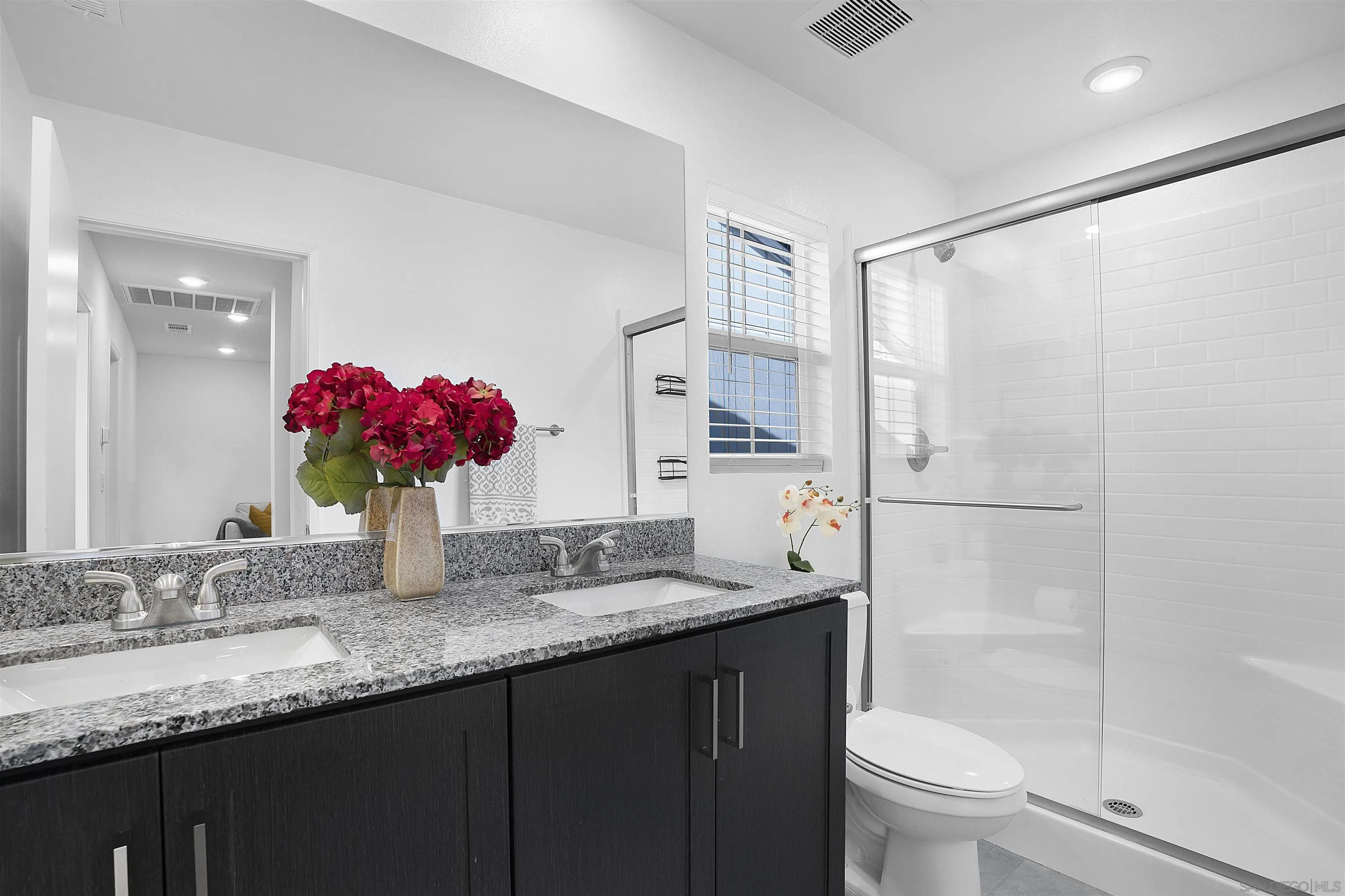 223 Foliage Place Fallbrook, CA 92028 - Photo 21 of 46 a bathroom with a granite countertop sink mirror and toilet