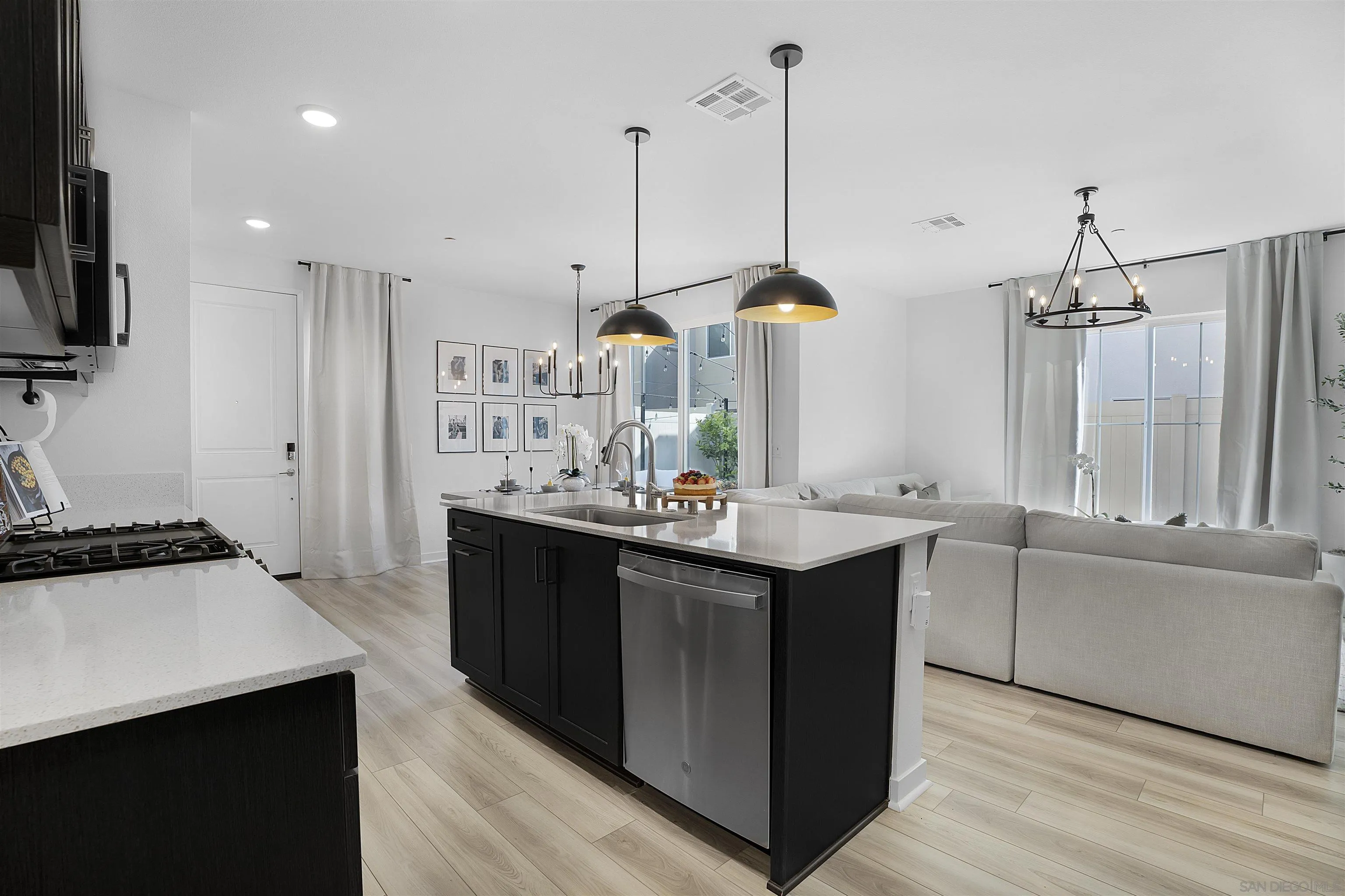 223 Foliage Place Fallbrook, CA 92028 - Photo 3 of 46 a kitchen with stainless steel appliances a sink stove and refrigerator