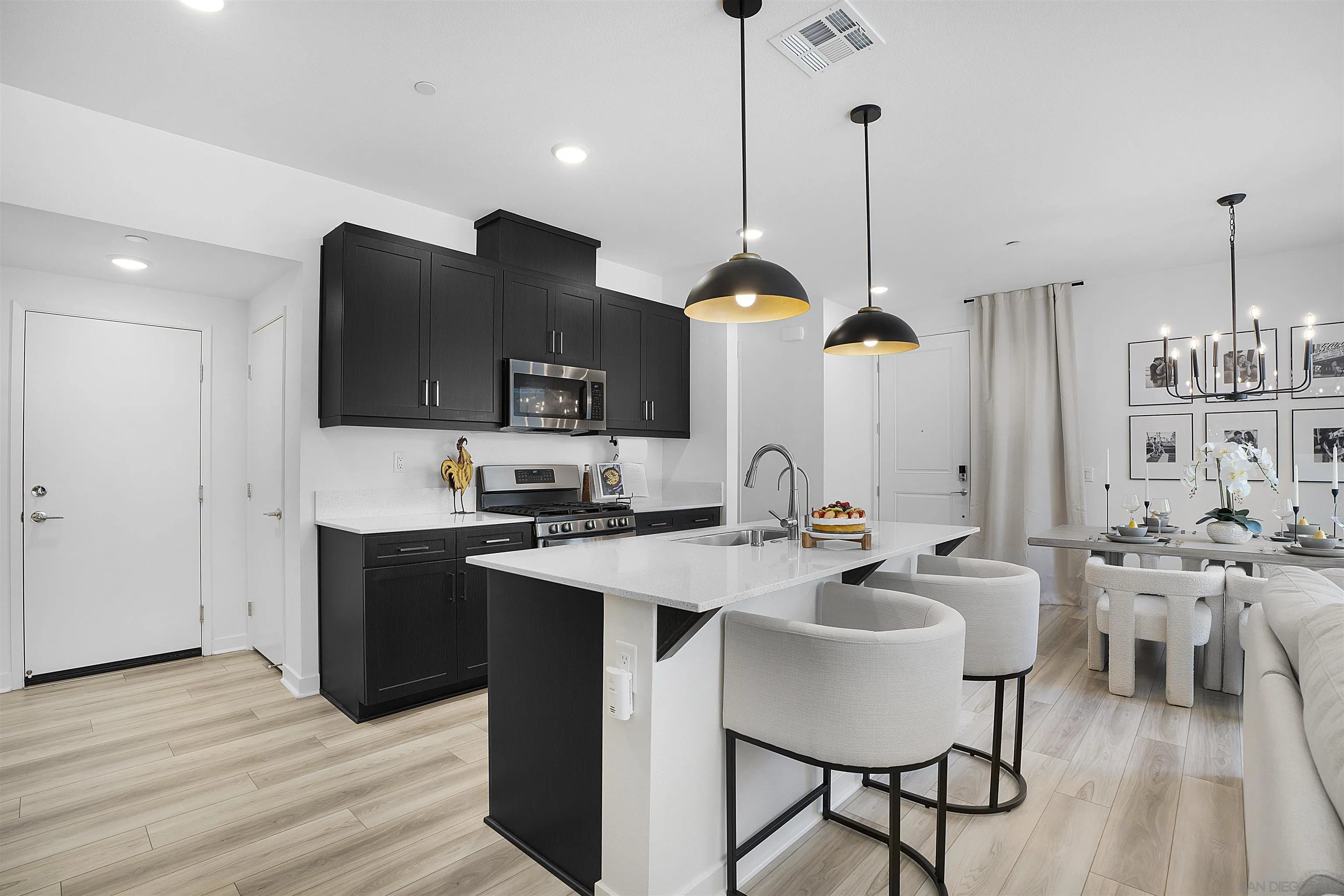 223 Foliage Place Fallbrook, CA 92028 - Photo 4 of 46 a kitchen with a sink cabinets and wooden floor