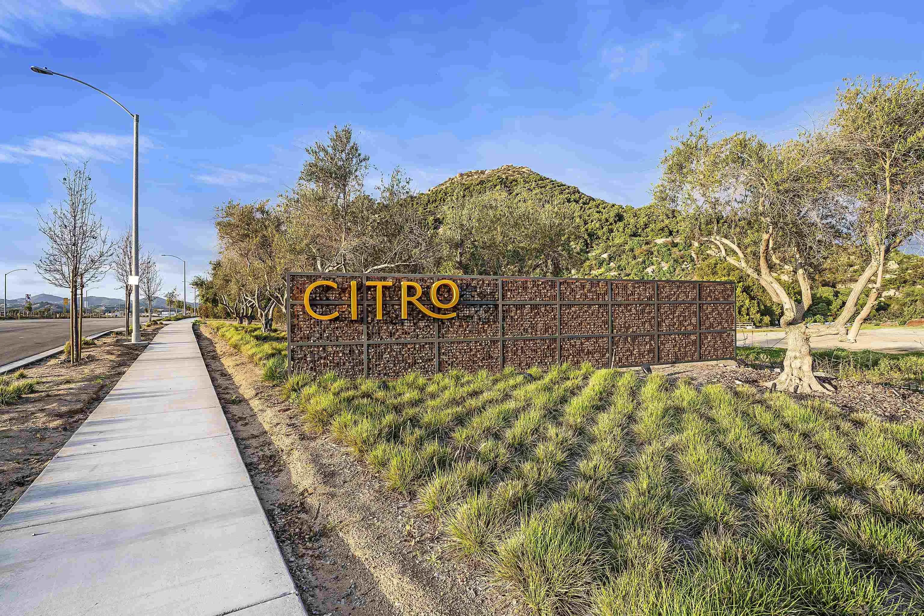 223 Foliage Place Fallbrook, CA 92028 - Photo 45 of 46 a sign board with buildings in the background