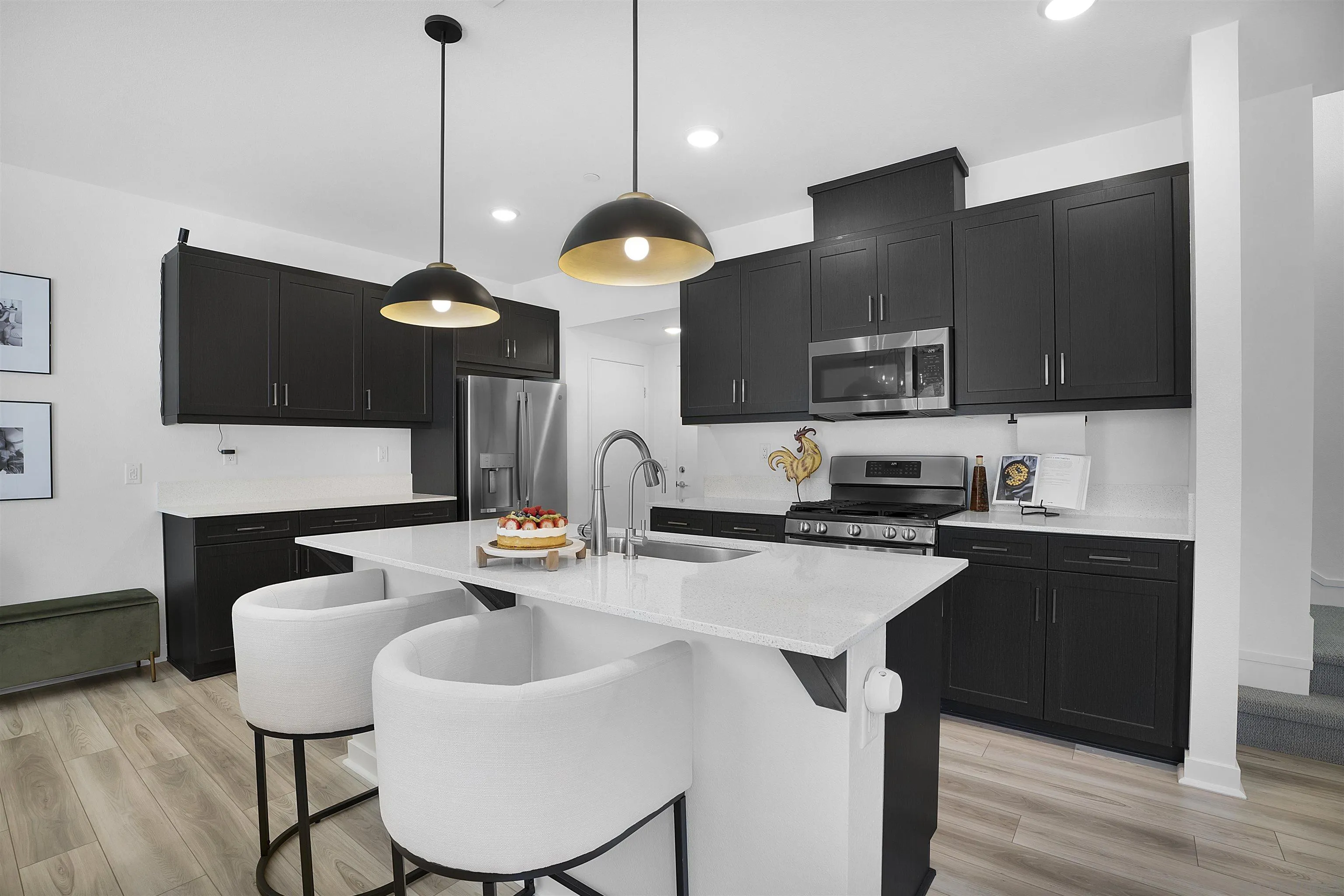 223 Foliage Place Fallbrook, CA 92028 - Photo 5 of 46 a kitchen with stainless steel appliances kitchen island granite countertop a sink a stove and chairs