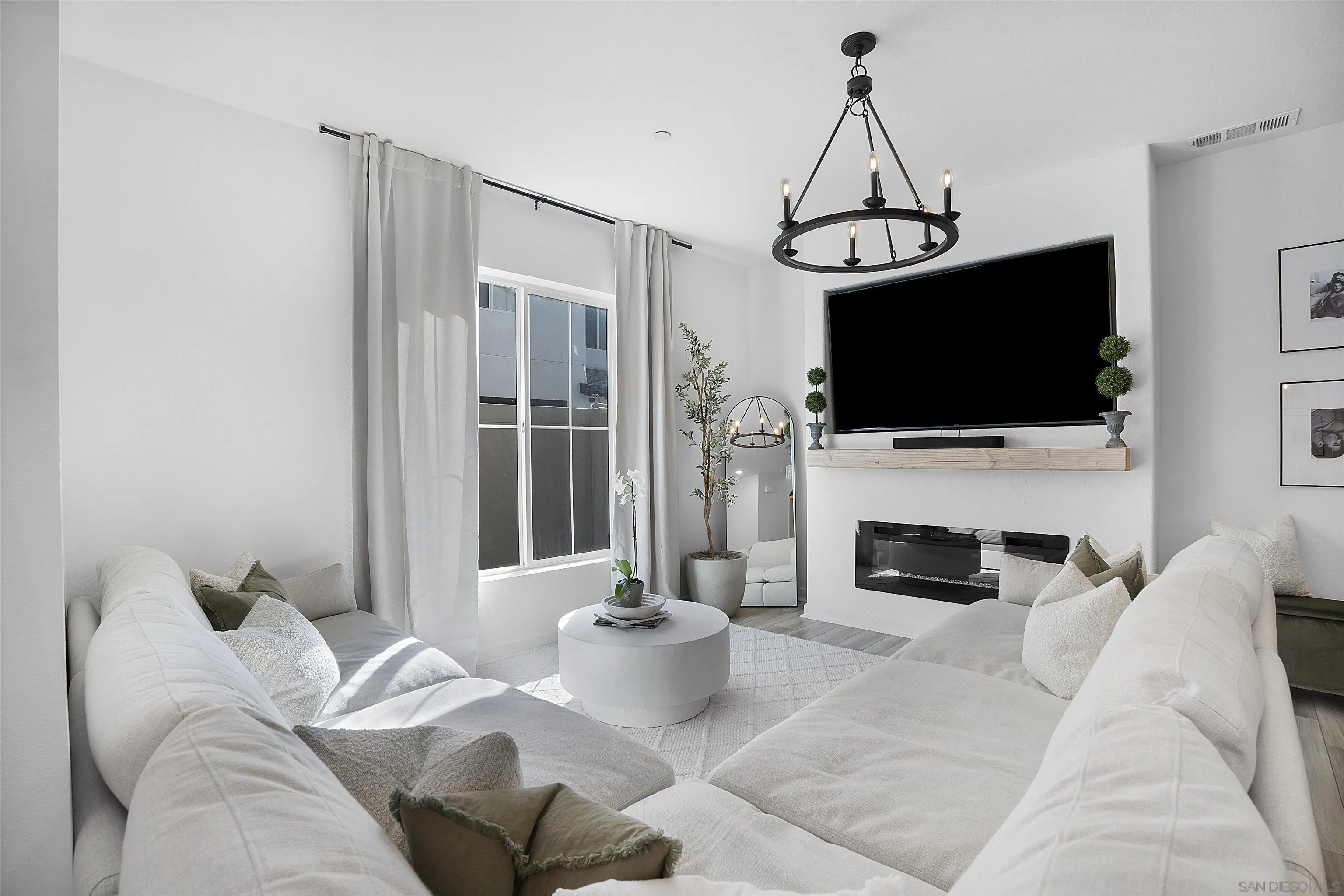 223 Foliage Place Fallbrook, CA 92028 - Photo 8 of 46 a living room with furniture a flat screen tv and a fireplace