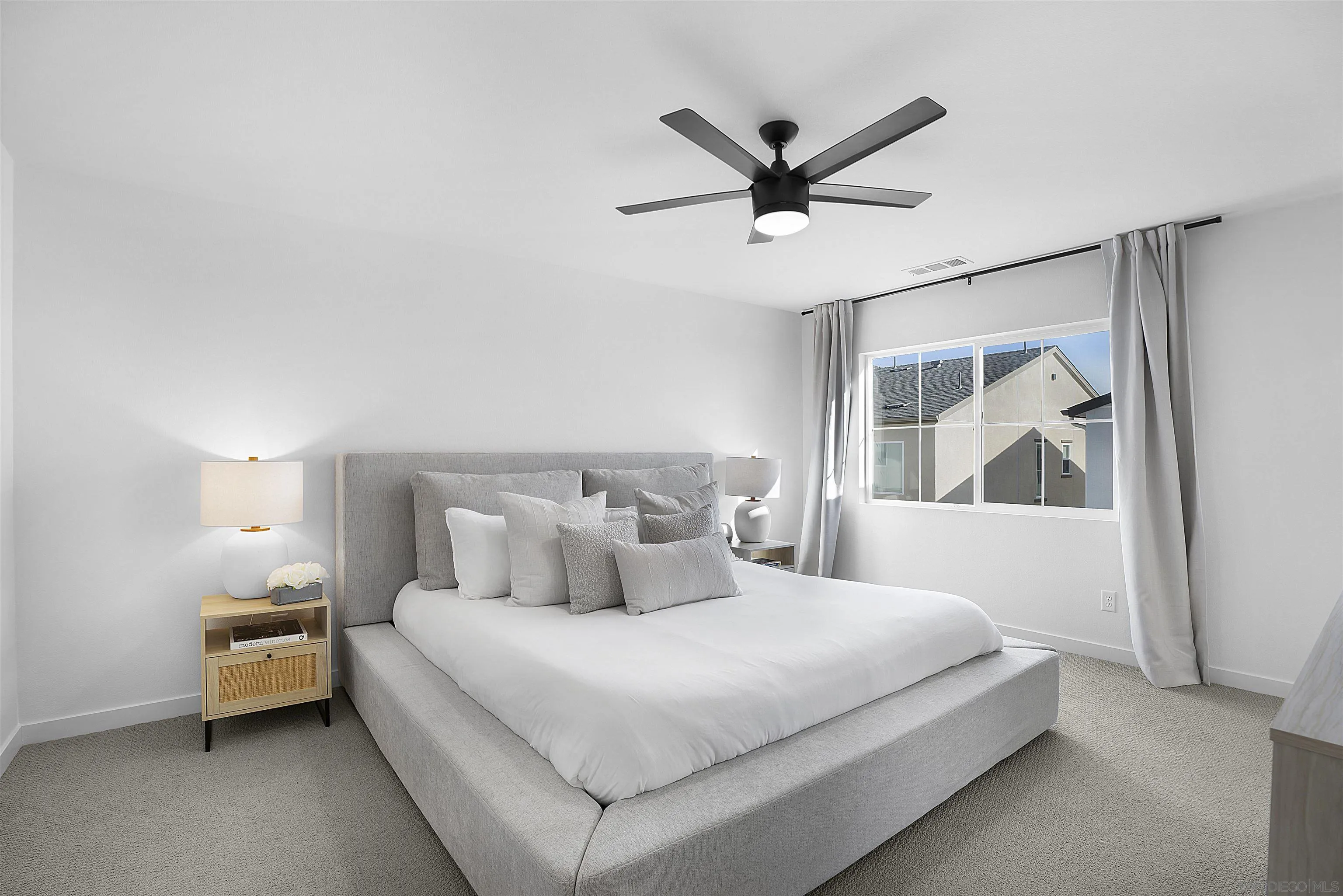 223 Foliage Place Fallbrook, CA 92028 - Photo 10 of 46 a bedroom with a large bed and a chandelier