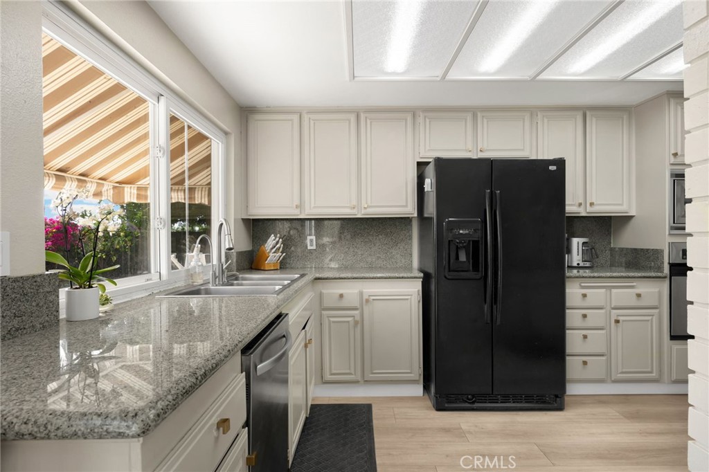 536 Silver Canyon Way Brea, CA 92821 - Photo 11 of 40 a kitchen with stainless steel appliances granite countertop a refrigerator and a sink