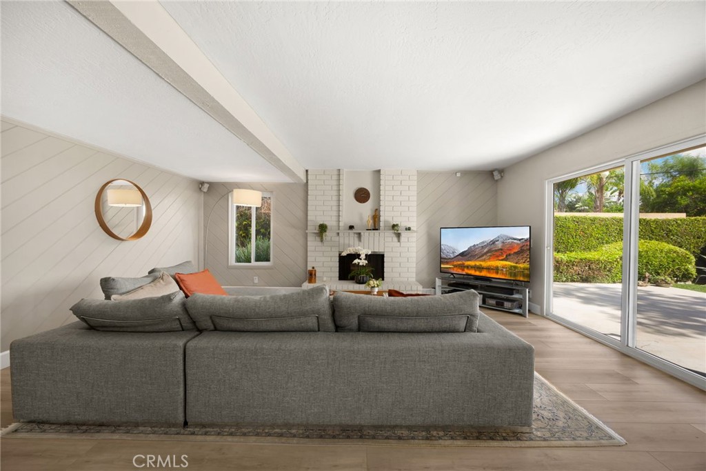 536 Silver Canyon Way Brea, CA 92821 - Photo 16 of 40 a living room with furniture a fireplace and a large window