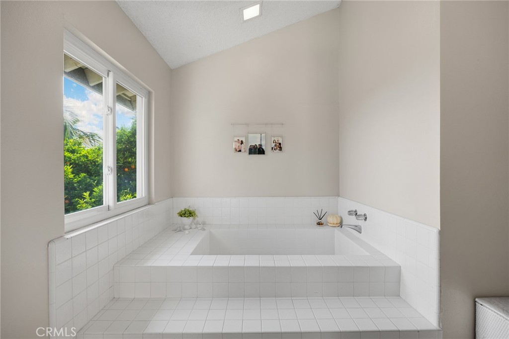536 Silver Canyon Way Brea, CA 92821 - Photo 30 of 40 a bathroom with a bathtub and window