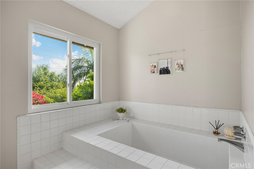 536 Silver Canyon Way Brea, CA 92821 - Photo 31 of 40 a bathroom with a bathtub and window