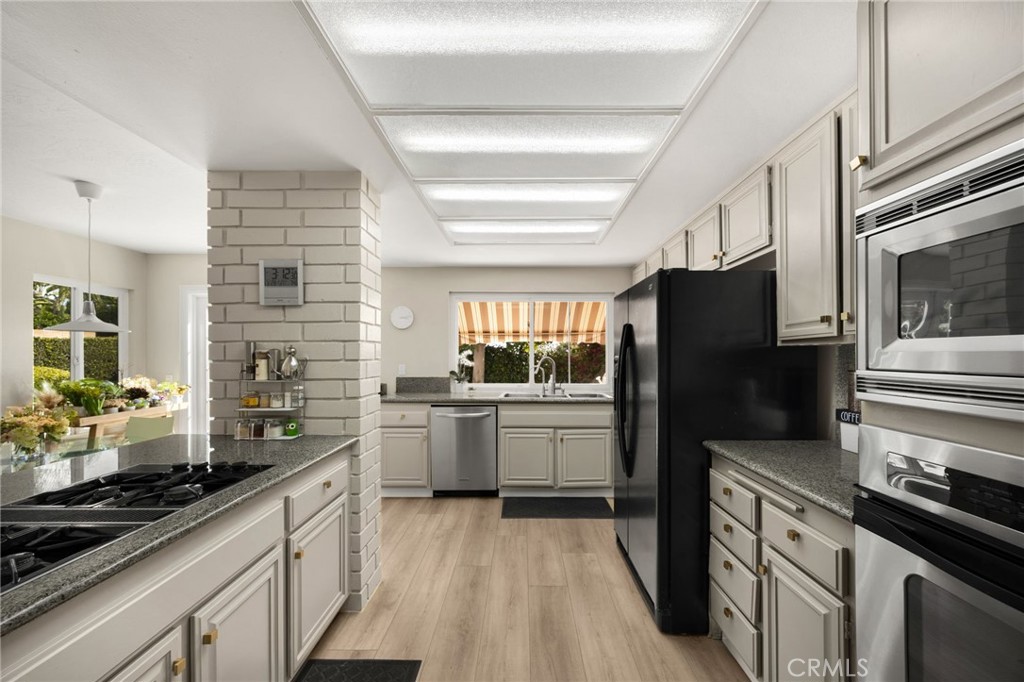 536 Silver Canyon Way Brea, CA 92821 - Photo 10 of 40 a kitchen with a sink stainless steel appliances and cabinets