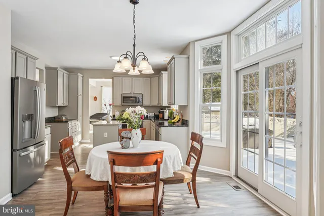 a kitchen with lots of counter top space and dining table