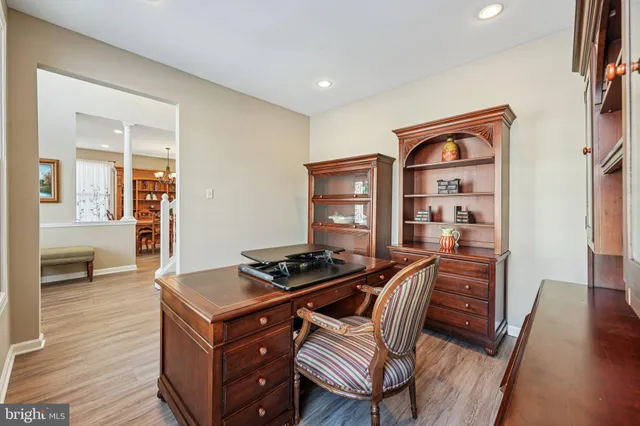 a spacious bedroom with a bed and a chandelier