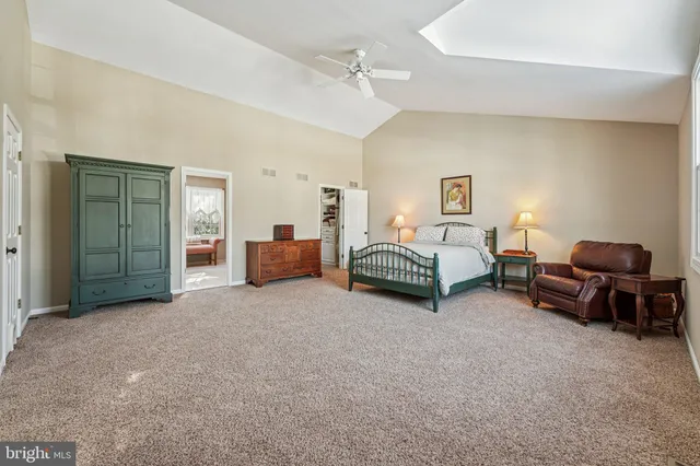 a bedroom with bed and a window