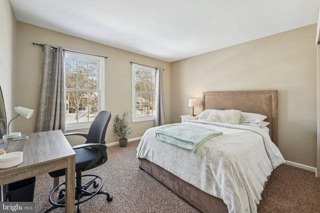 an aerial view of residential houses with city view