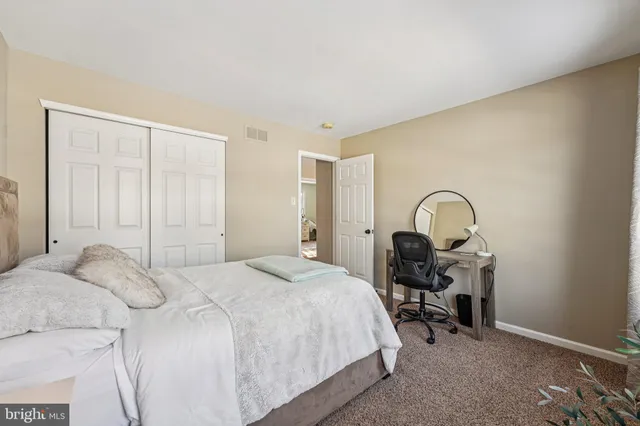 an aerial view of residential houses with city view