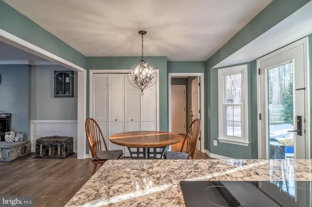 a living room with furniture a window and a table