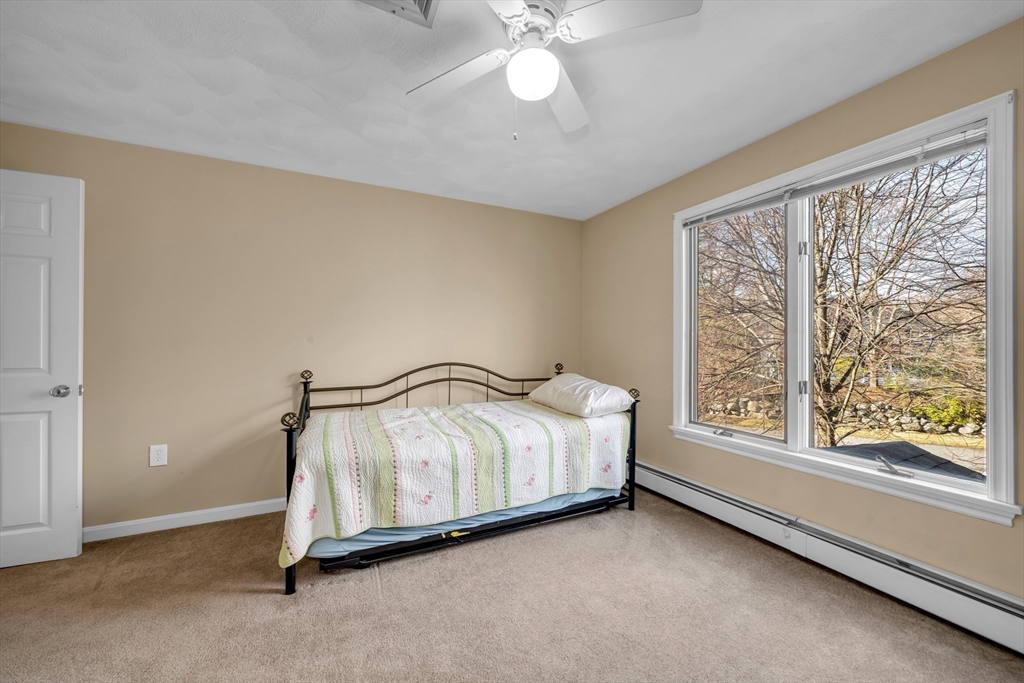 315 Candlestick Road North Andover, MA 01845 - Photo 31 of 42 a room with a bed and a large window