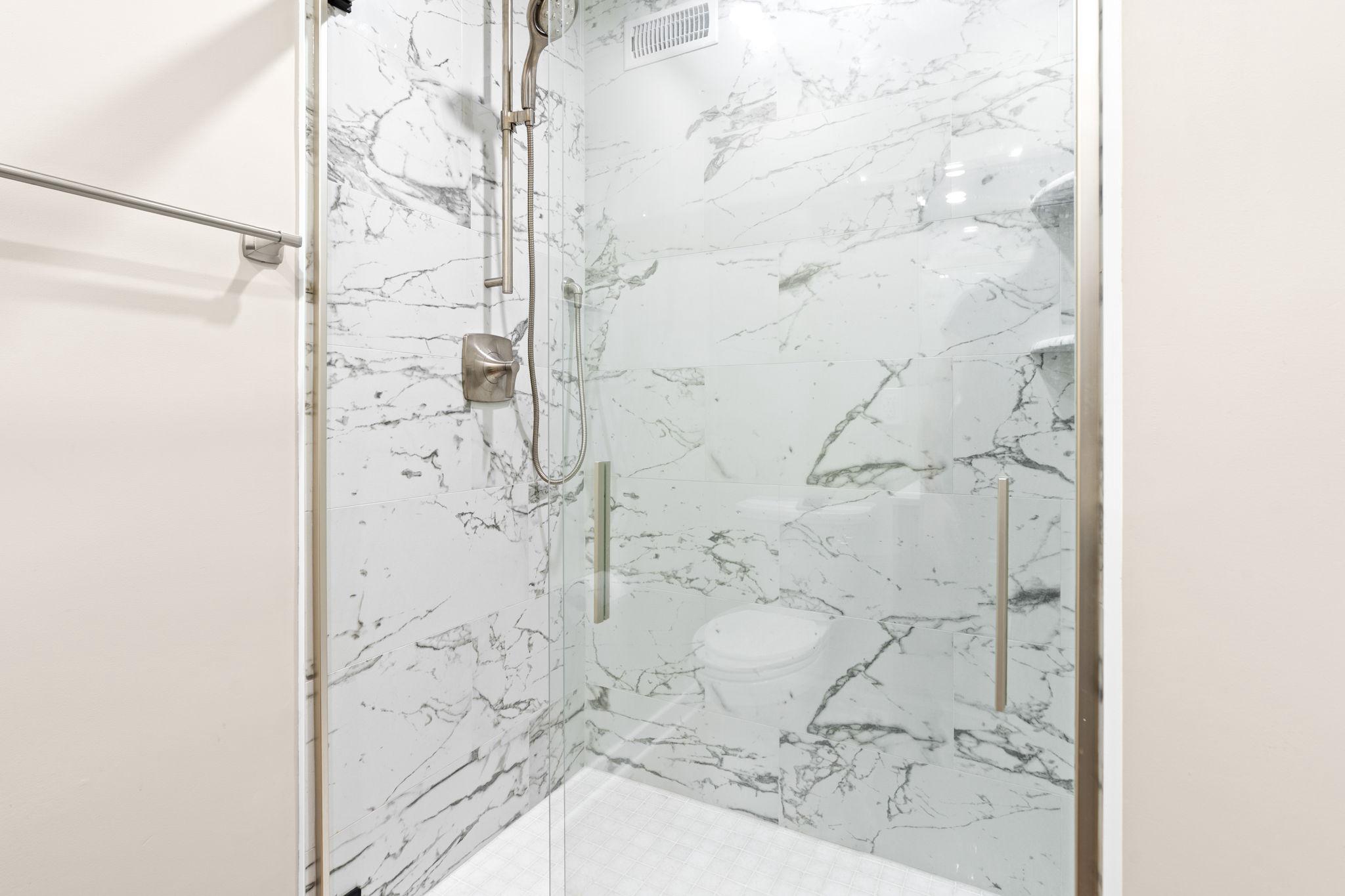 5002 Burkittsville Road Jefferson, MD 21755 - Photo 15 of 40 Sleek marble shower on the first floor