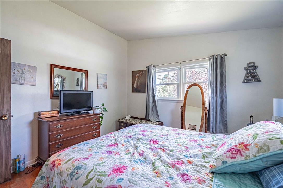 579 Cherry Road Northampton, PA 18067 - Photo 34 of 57 Bright windows illuminate this cozy bedroom with wood flooring and ample space.